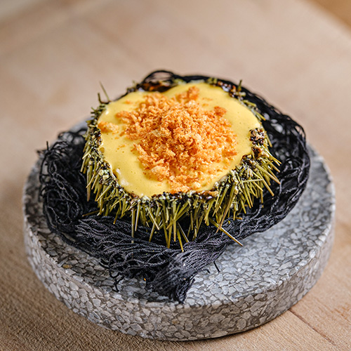 Fotografía de un plato del restaurante Miga con iluminación de estudio.